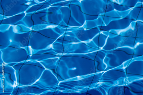 Navy blue water in pool view from above, texture or background
