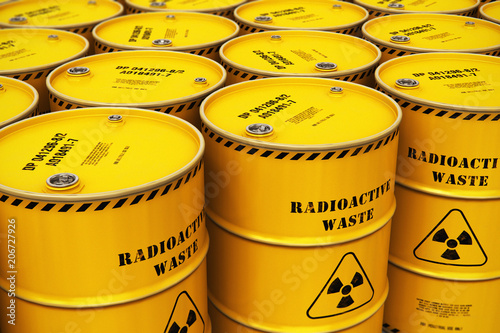 Photo Group of stacked yellow drums with radioactive waste