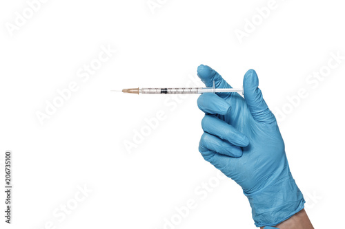 Hand in blue glove holding syringe