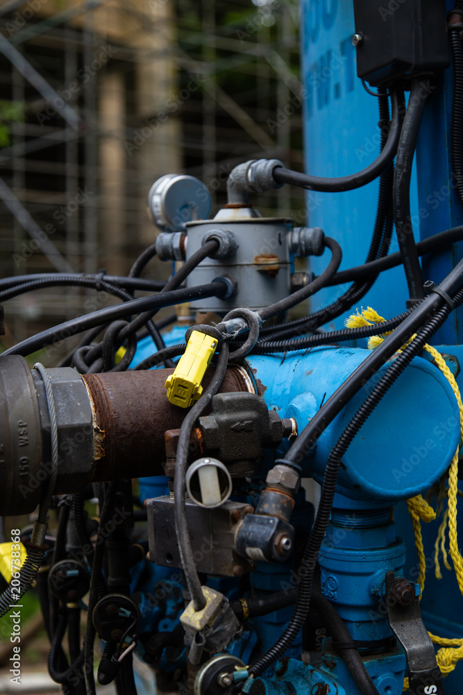 Fototapeta premium Blue Industrial Machinery with Pipes 