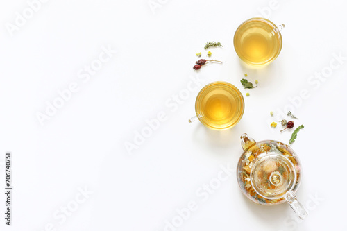 Herbal tea of mint, chamomile, rose hip and other herbs on white background.