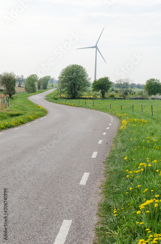 Wind turbine by a winding country road