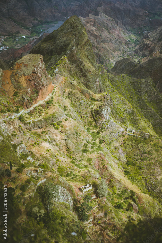 Obraz premium Spectacular view above sharp mountain ridge. Green valleys stretch down both sides of the ridge. Trail to Caculi Cape Verde Santo Antao