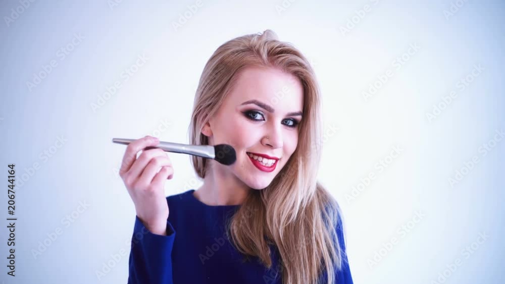 Sexy blonde applying makeup . Sexy woman with makeup Sexy blonde applying makeup . Sexy woman with makeup