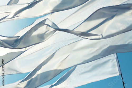 Wallpaper Mural A waving white long triungular flags and ribbons on a background bright blu sky Torontodigital.ca