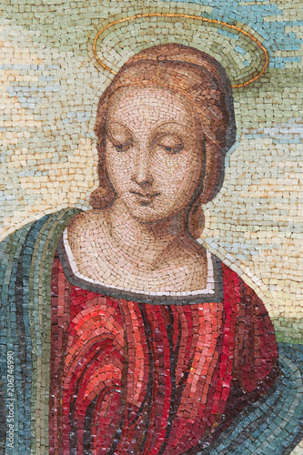 A very nice madonna made in glass and marble mosaic tiles. The style looks like the Madonna del Cardellino of Raffaello Sanzio, the famous artist of Italian Renaissance. photo