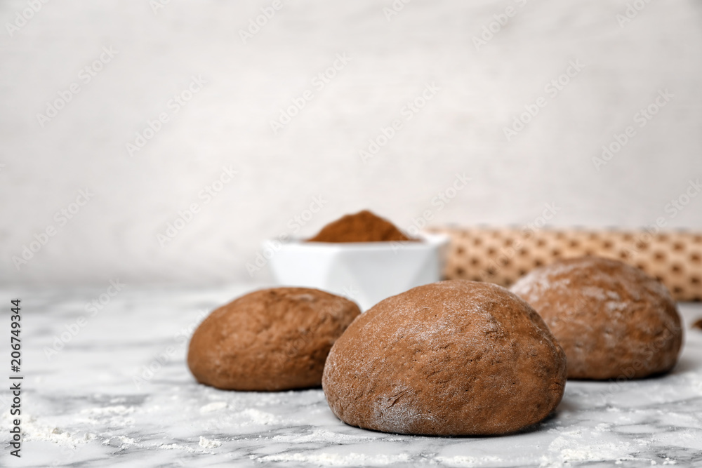 Raw rye dough on table against light background Raw rye dough on table against light background