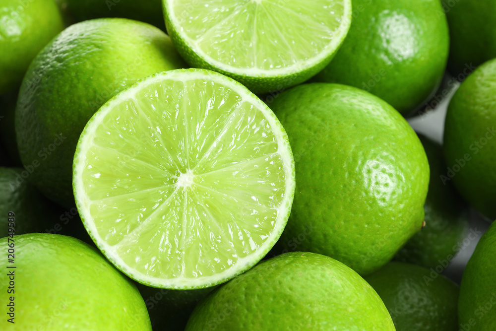 Fresh ripe green limes as background
