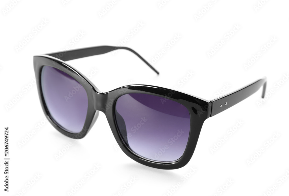 Beautiful sunglasses on white background. Beach object