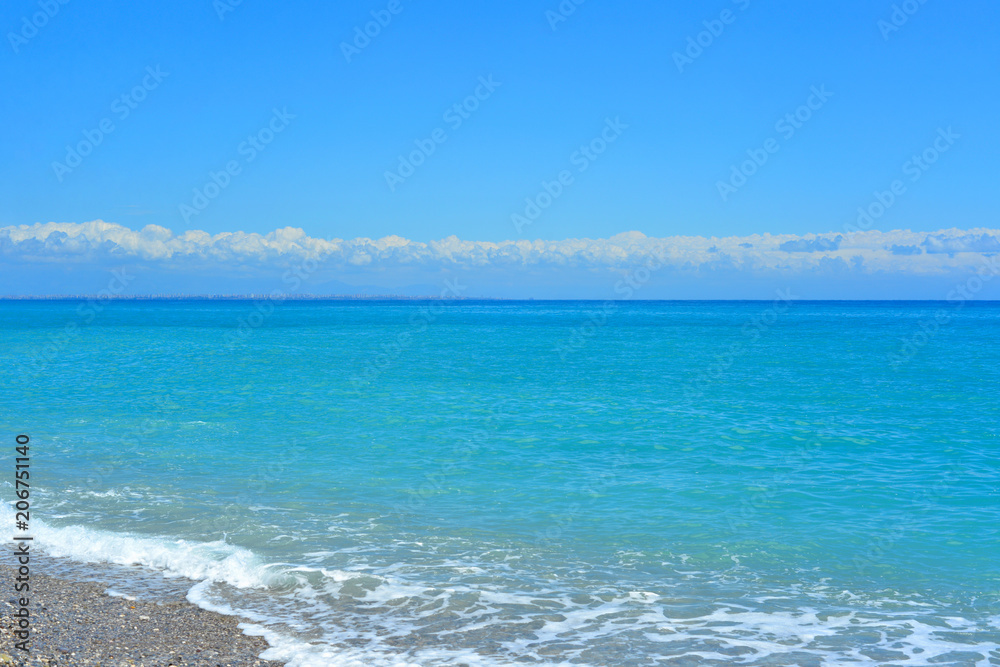 Fototapeta premium summer landscape sea view at a pebble beach