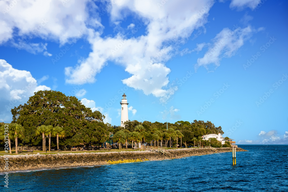 White Lighthouse Rising from Coastal Park