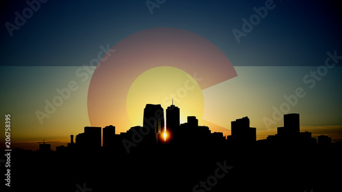 Denver Skyline Sunrise with Colorado Flag in Sky photo