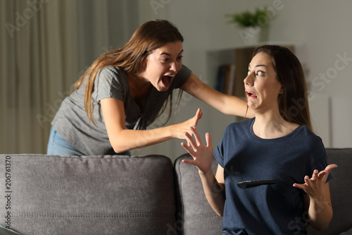 Woman giving a fright to a friend