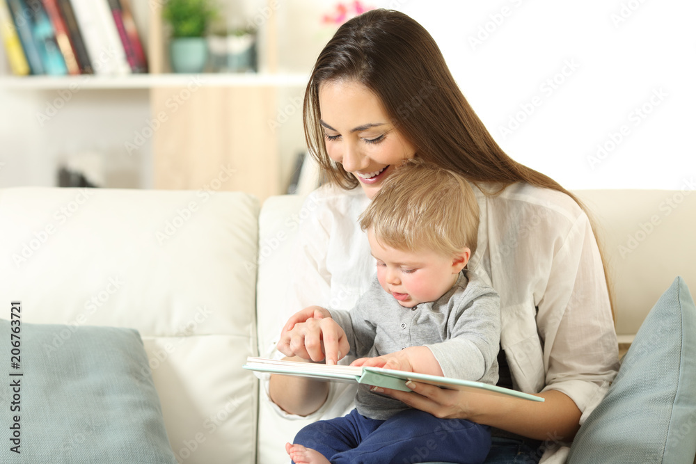 Baby and mother reading a book together Baby and mother reading a book together