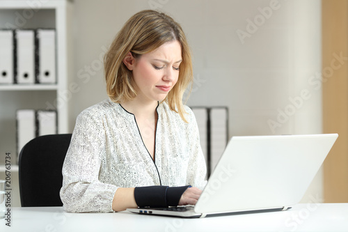 Handicapped office worker working online
