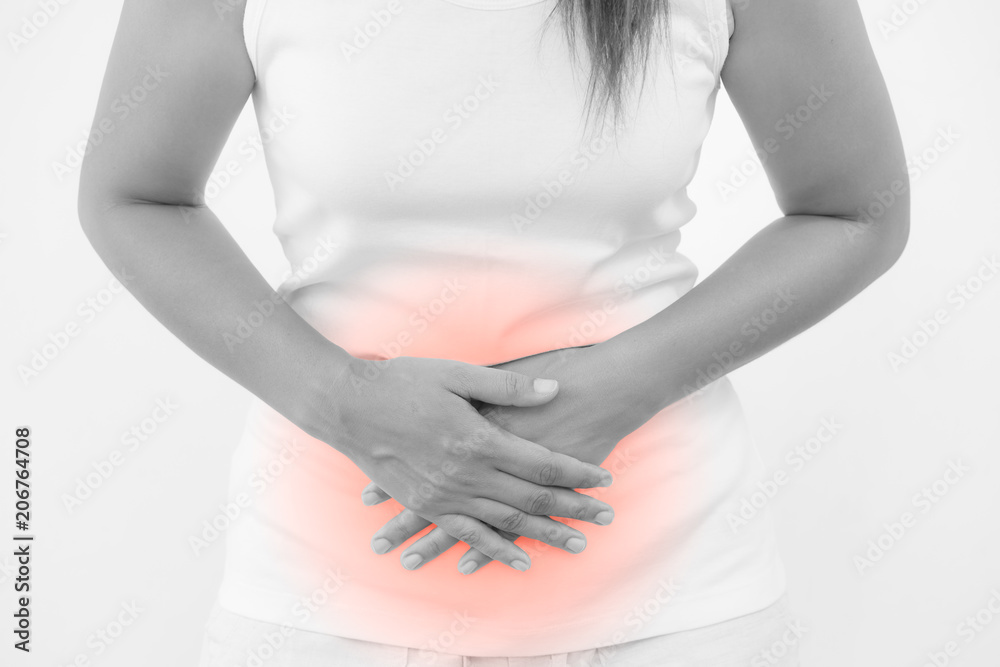 Young beautiful woman having painful stomachache on white background.Chronic gastritis. Abdomen bloating concept. Young beautiful woman having painful stomachache on white background.Chronic gastritis. Abdomen bloating concept.