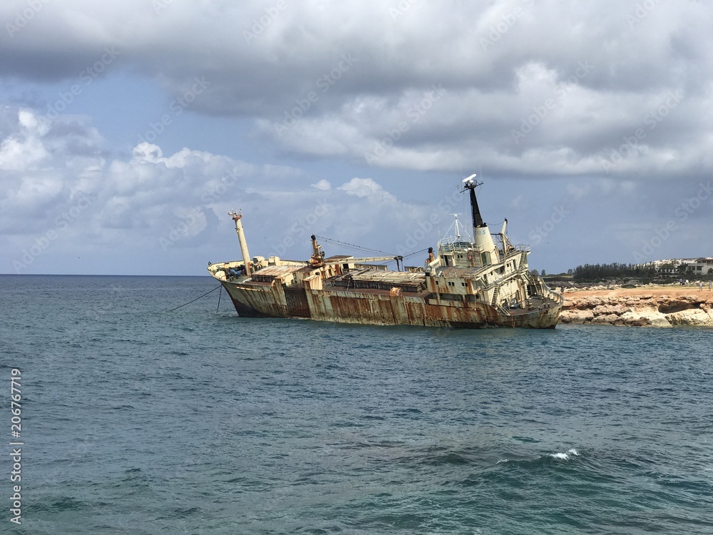Old sunken boat ship near the shore