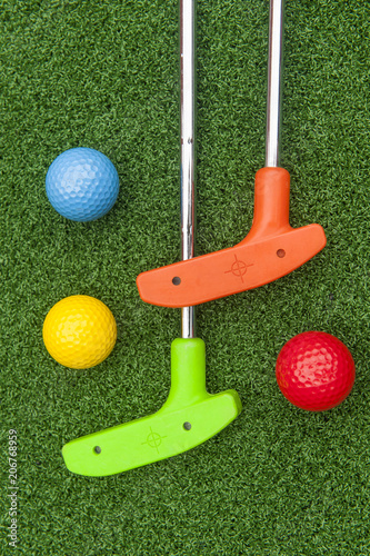 Colorful Putt Putt clubs and Balls photo