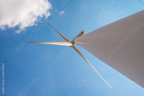 Wind turbines generating electricity with blue sky