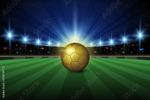 Soccer stadium with golden ball, green grass and night sky