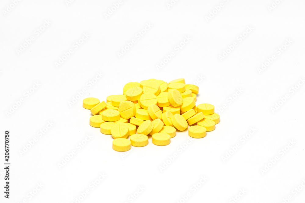Yellow medicine pill cure heal drug group close up isolated on white background Yellow medicine pill cure heal drug group close up isolated on white background