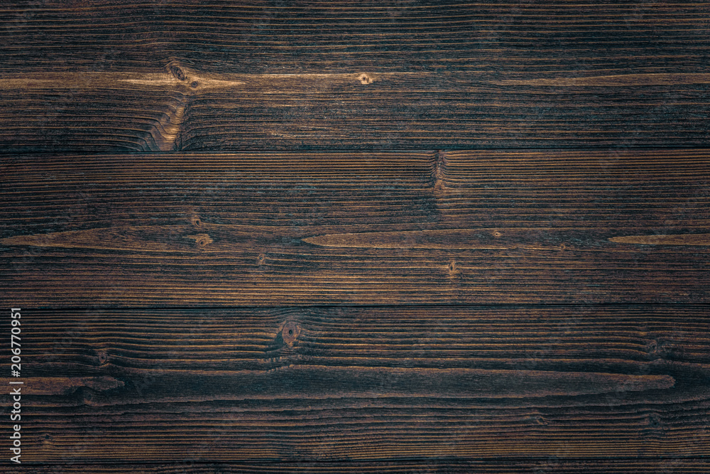 Fototapeta premium Dark brown wood texture with natural striped pattern background