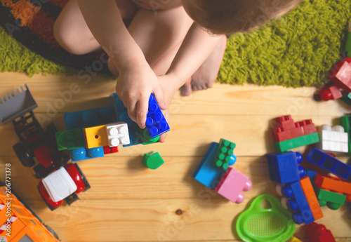 Kid playing with toys blocks 