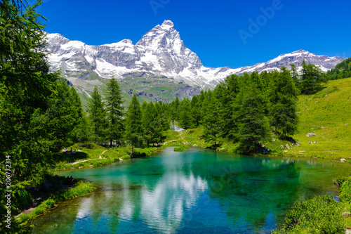 Beautiful landscape with the Matterhorn (Cervino) and another Matterhorn (Cervino) reflected on the Blue Lake (Lago Blu) near Breuil-Cervinia, Aosta, Italy