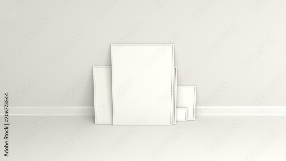Blank white posters in white frames standing on the floor Blank white posters in white frames standing on the floor