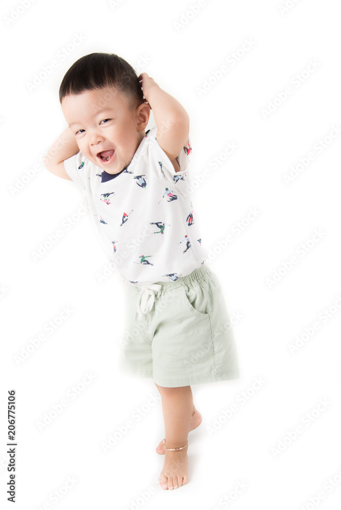 Happy toddler boy jumpping with smile face say Huray on white background Happy toddler boy jumpping with smile face say Huray on white background