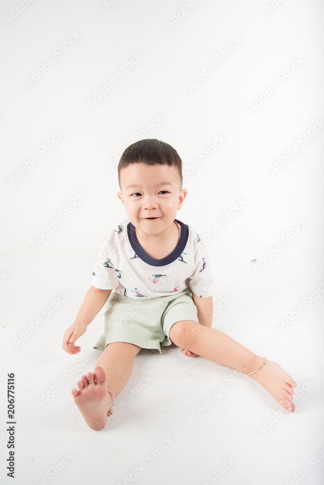Happy toddler boy jumpping with smile face say Huray on white background Happy toddler boy jumpping with smile face say Huray on white background