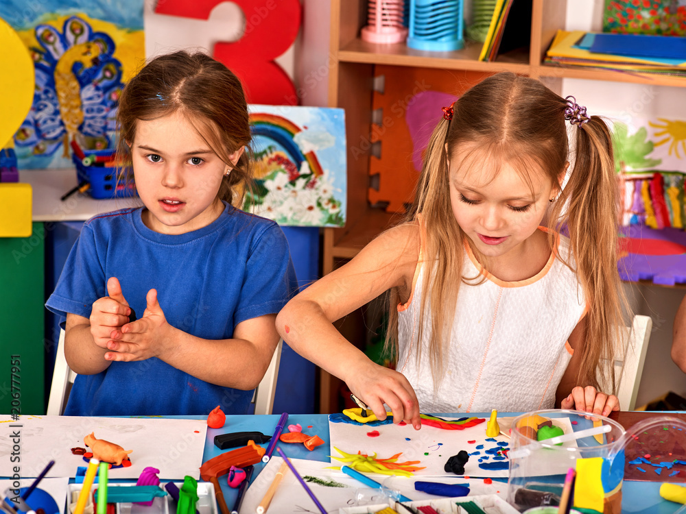 Plasticine Modeling Clay In Children Class. Teacher Teaches Kids Together  Play Dough And Mold From Plasticine In Kindergarten Or Preschool. Group Of  Four People. Zoo From The Clay. Stock Photo, Picture and