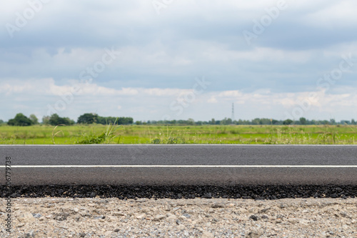 Asphalt road with overcast clouds.