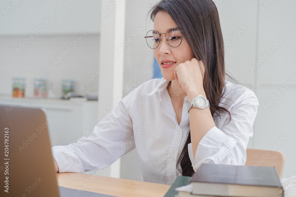 Asian business woman working in modern office with copy space. Asian business woman working in modern office with copy space.