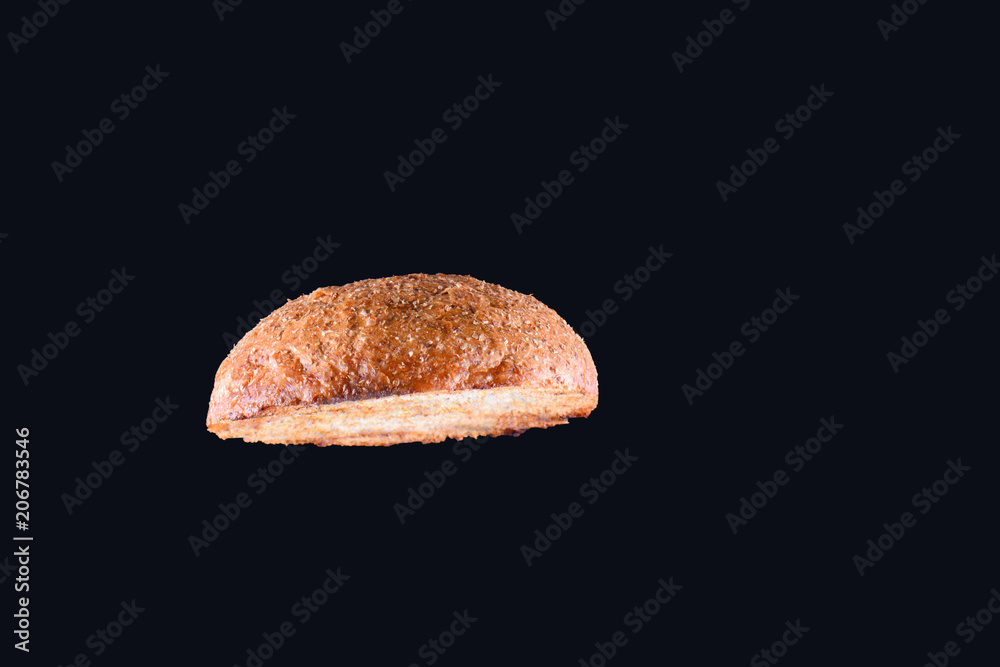Grilled burger bun isolated on black background. Close up Grilled burger bun isolated on black background. Close up
