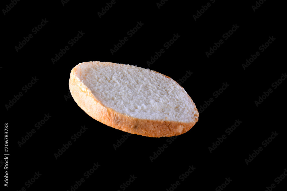 Fototapeta premium Grilled burger bun isolated on black background. Close up