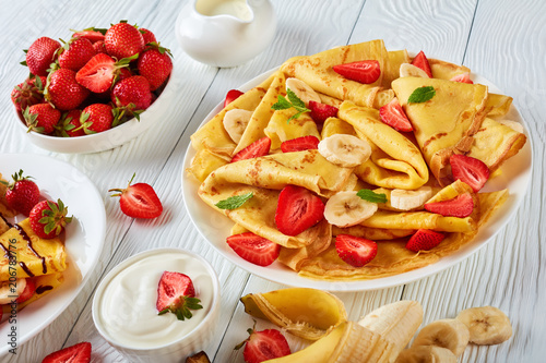 thin pancakes or crepes with fruits