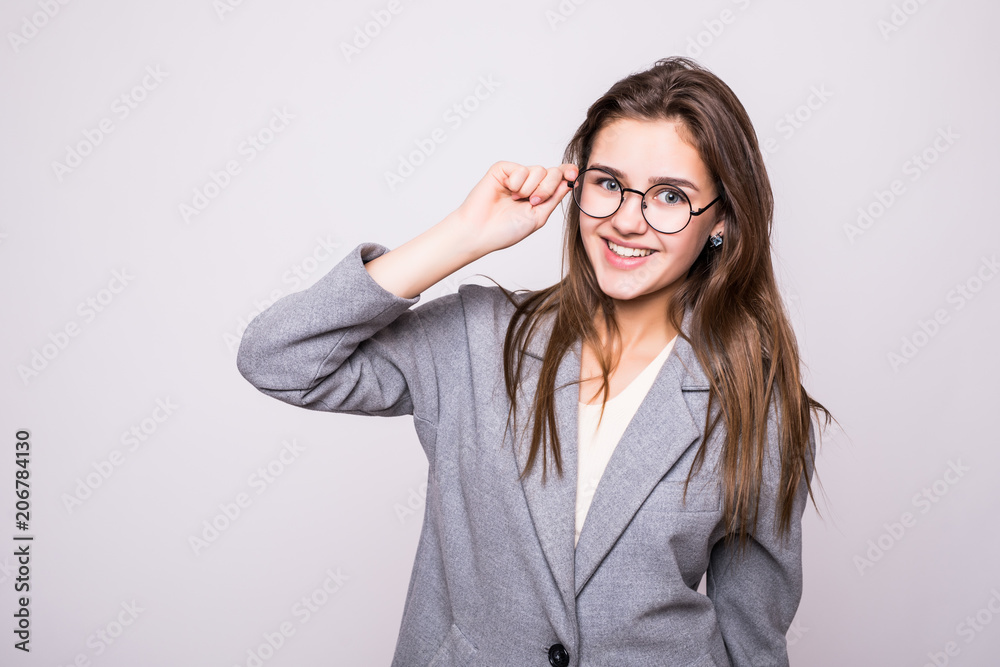 Headshot of cute student girl with stylish eyeglasses smiling broadly, having carefree and relaxed look isolated on white