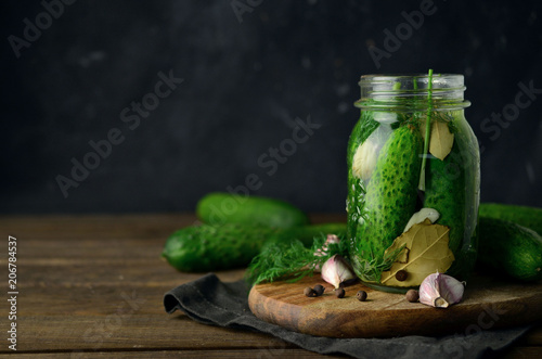 Pickled cucumbers with herbs and spices 