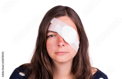 Leinwand Poster Portrait of woman wearing eye patch as protection after injury