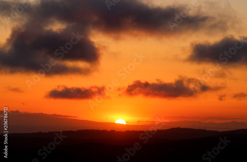 Vivid orange sky at sunset over Laguna Beach California  © K KStock