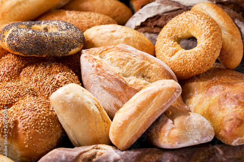 various types of fresh bread as background