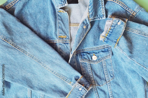 Blue oversized denim jacket/ Closeup flat lay fashion photo. 90s style oversized denim jacket