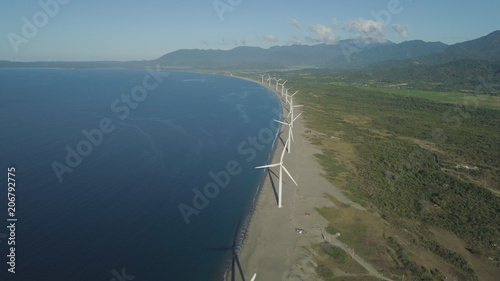 Aerial view of Windmills for electric power production on the coast. Bangui Windmills in Ilocos Norte  Philippines. Ecological landscape  Windmills  sea  mountains. Pagudpud