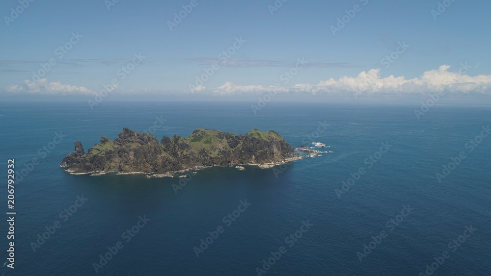 Small rocky islands in the sea, blue sky and clouds. Dos Hermanas, Palau, Santa Ana. Aerial view of seascape with tropical islands in the ocean.