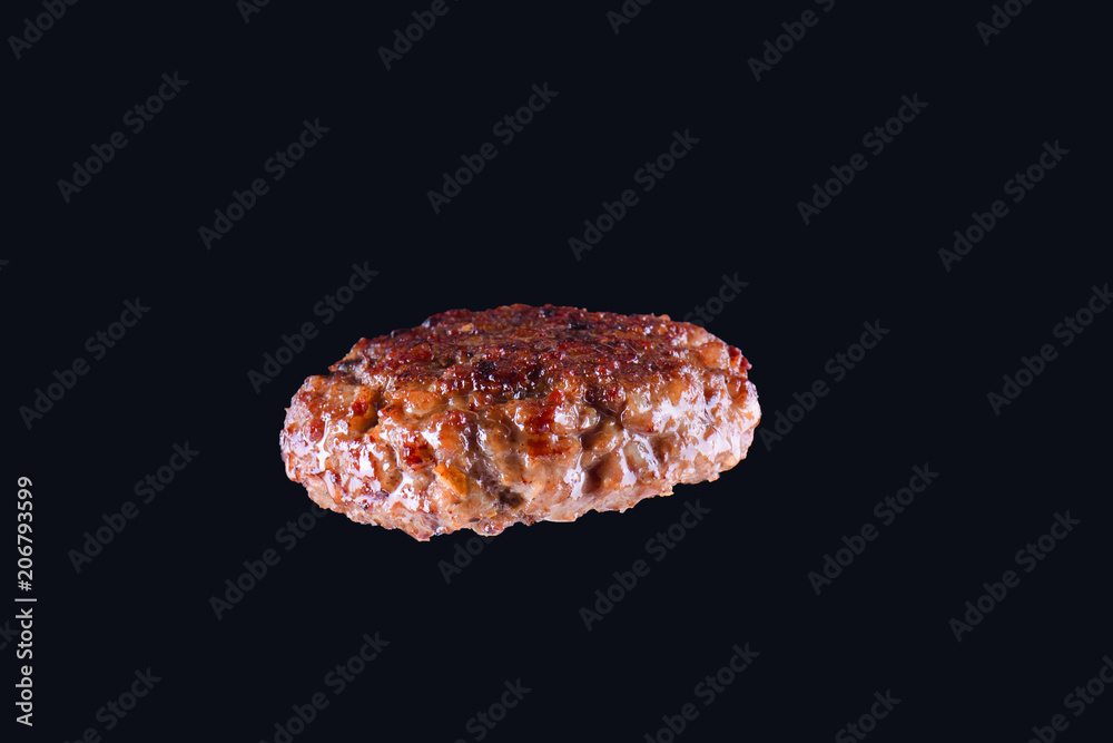 Fried fresh large beef burger isolated on white background. Grilled burger cutlet isolated on black Fried fresh large beef burger isolated on white background. Grilled burger cutlet isolated on black