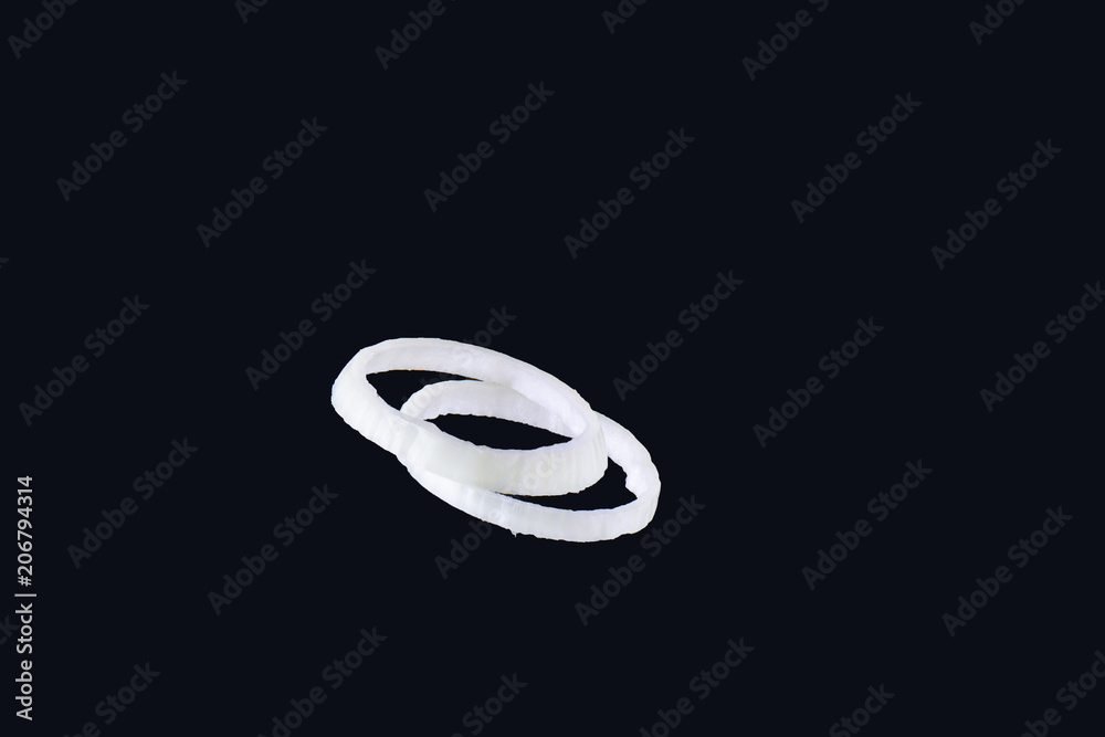 Onion slice isolated on black. Onion ring