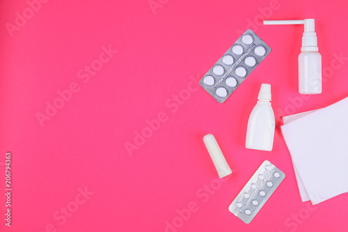 Medical remedies for colds, flu on a pink pastel background. Top view. Flat lay. Copy space.