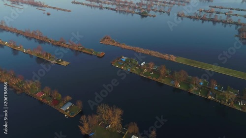 Aerial view of recreational harbour for small boats and bungalows on the lake at Loosdrecht Kalverstraat, the Netherlands. photo