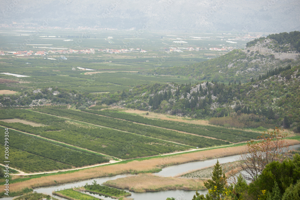 Top view of agricultural land. Valley of fields with irrigation system